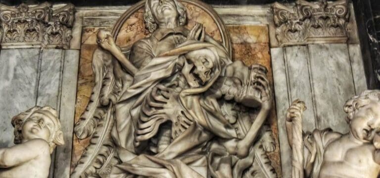 close up of the funeral monument showing the details of the skeleton representing death