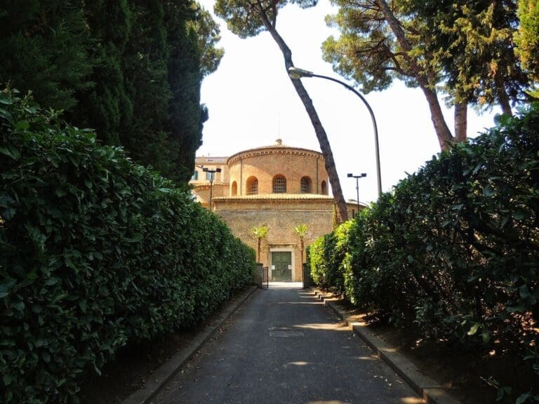 View of Santa Constanza down a bushy avenue