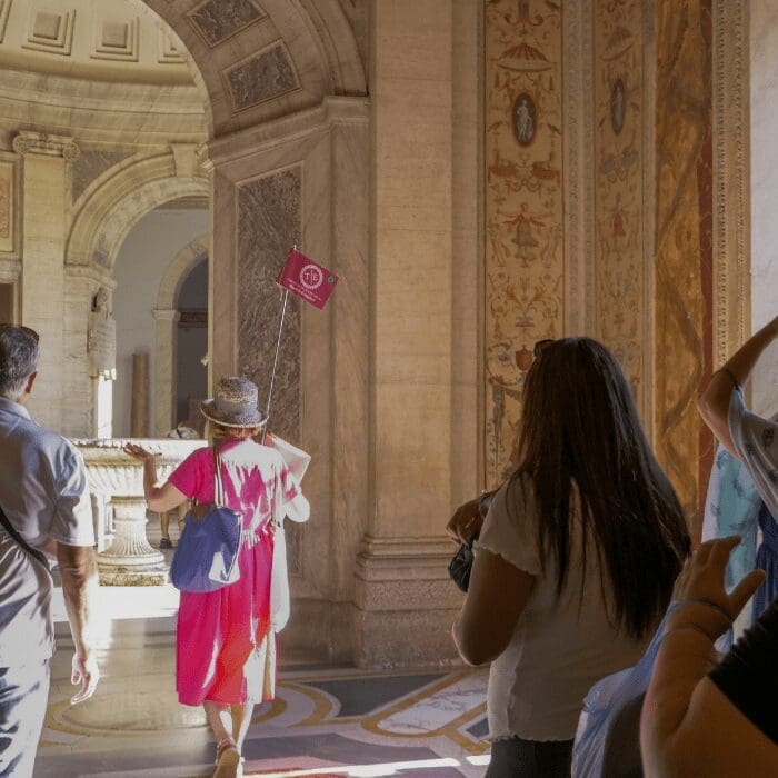 Tour Guide taking group into the Vatican