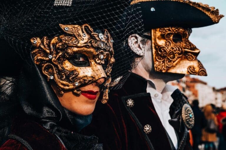 two masked figures during carnival in Venice