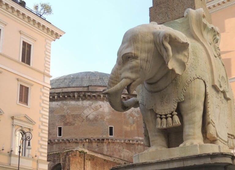 detail of bernini's elephant with the pantheon in the background