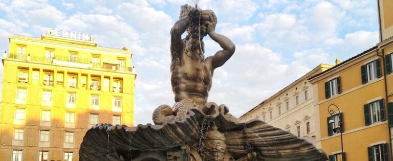 Bernini's Triton Fountain at Piazza Barbernini in Rome showing Triton blowing water through a conch