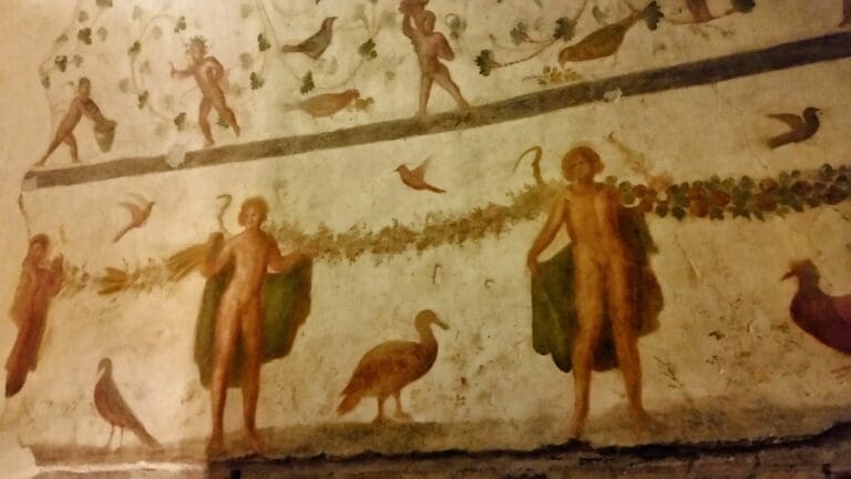 Ancient fresco with pagan imagery in the ctacombs of Domitilla in Rome