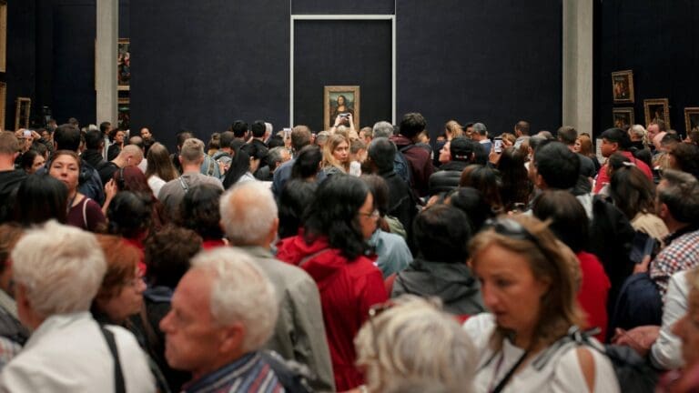 crowds in front of the mona lisa at the louvre in paris france