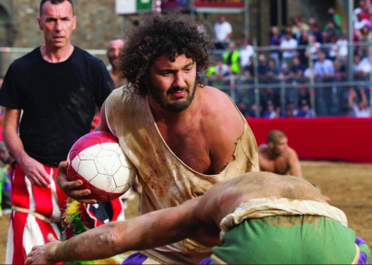 Players fight for the ball, Calcio Storico in Florence