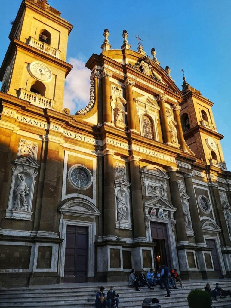 Facade of the Cathedral in Frascati illuminated in dappled sunlight
