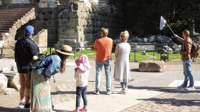a family takes a tour of the roman forum
