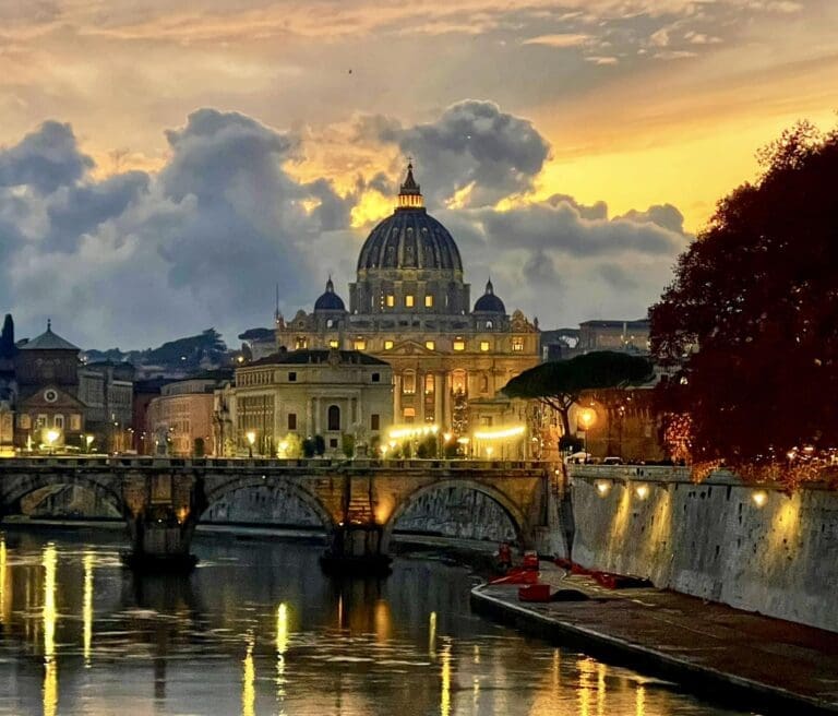 sunset over ponte umberto I in rome