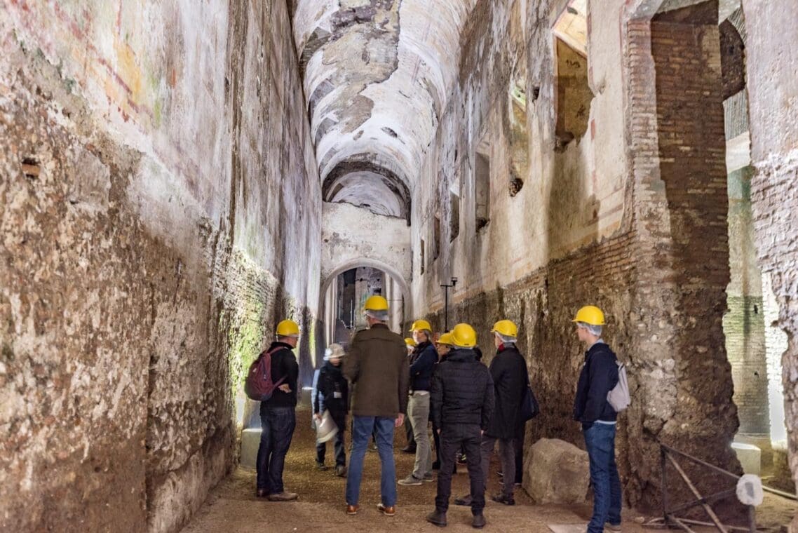 a group enjoy the scale and grandeur of the Domus Aurea