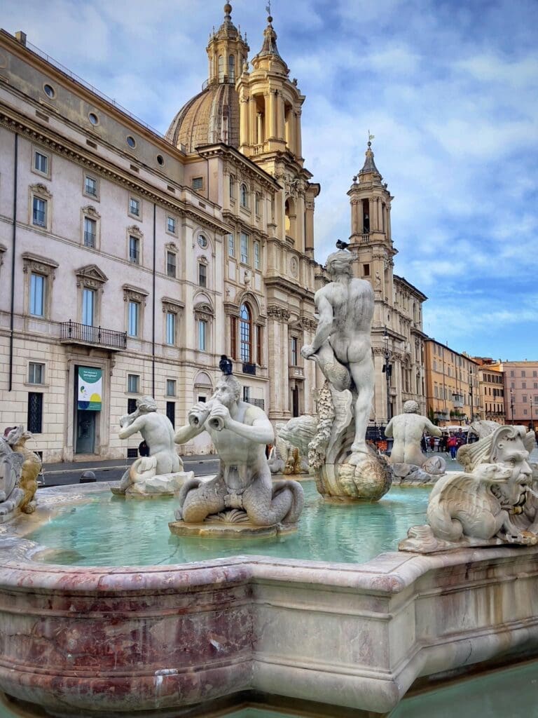 piazza navona in rome with the fountain of the moor and the church of sant'agnese in agone
