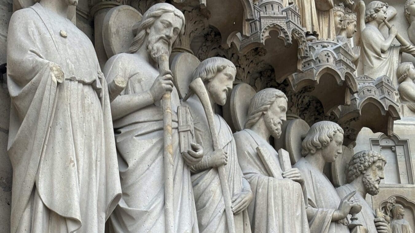 up close image of the sculptures of Notre Dame showing various saints